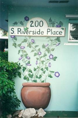 Painting with street address on an outside wall