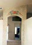 Faux stone archway with tropical flowers